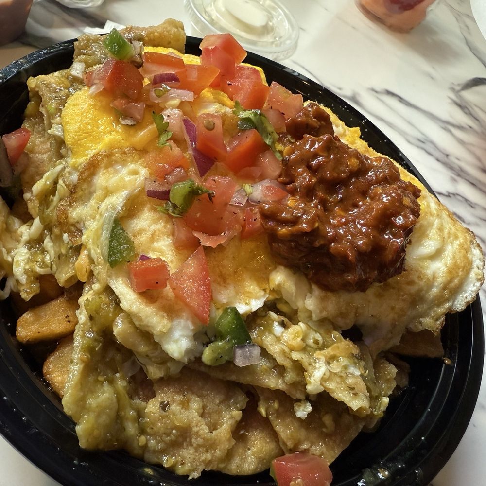 Village Cafe - Weekend special green chilaquiles I added their spicy salsa - Coffee & Tea Near Me - Camarillo, California Village Cafe - Weekend special green chilaquiles I added their spicy salsa - Coffee & Tea Near Me - Camarillo, California