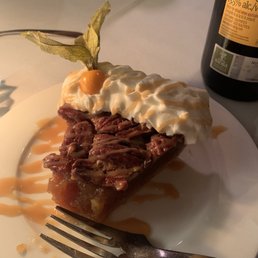 a piece of pie on a plate with a fork