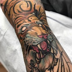 Bombshell Tattoo - Oriental inspired work by twice voted Edmonton's Best tattooer Chris Iwaniuk.