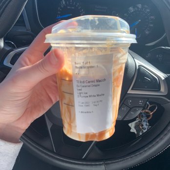 Starbucks - a hand holding a cup of coffee - Coffee & Tea Near Me - Hammond, Louisiana Starbucks - a hand holding a cup of coffee - Coffee & Tea Near Me - Hammond, Louisiana