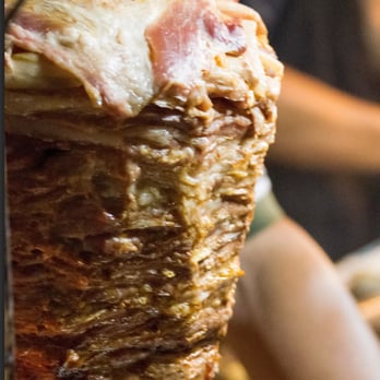 Delicious Tacos - a person holding a plate of food - Mexican Near Me - Los Angeles, California Delicious Tacos - a person holding a plate of food - Mexican Near Me - Los Angeles, California