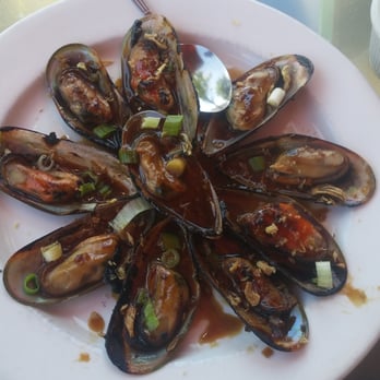 Simply Vietnamese - Mussels apetizer, really good. Seasoned, broiled and grilled with large nonfishy tasting mussels. - Vietnamese Near Me - Tenafly, New Jersey Simply Vietnamese - Mussels apetizer, really good. Seasoned, broiled and grilled with large nonfishy tasting mussels. - Vietnamese Near Me - Tenafly, New Jersey