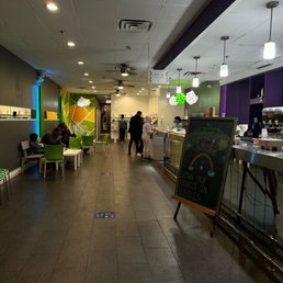 a cafeteria area with tables and chairs
