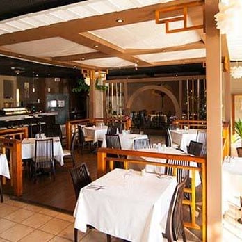 Akita - the interior of a restaurant with tables and chairs - Japanese Near Me - Montreal, Quebec Akita - the interior of a restaurant with tables and chairs - Japanese Near Me - Montreal, Quebec