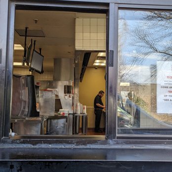 Burger King - a man in the window of a restaurant - Burgers Near Me - East Windsor, Connecticut