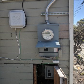 Julian's Electric & Digital - New main panel, pictured above ancient deactivated old main panel. Supported by some very professional looking unistrut. - Electricians Near Me - Lafayette, California Julian's Electric & Digital - New main panel, pictured above ancient deactivated old main panel. Supported by some very professional looking unistrut. - Electricians Near Me - Lafayette, California