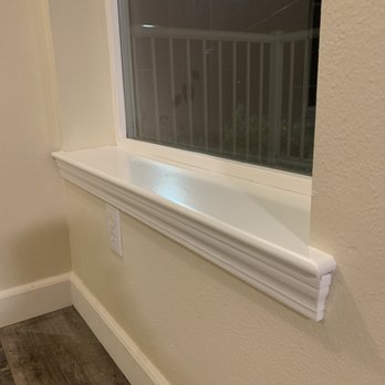 Reilex Construction - Alex painted the window sill white. - Tiling Near Me