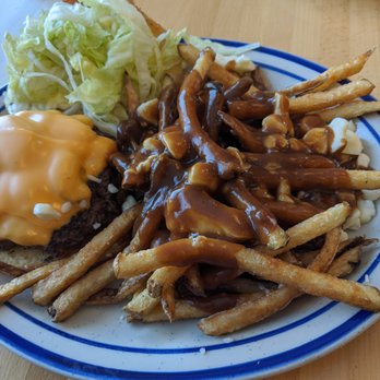 Whistle Stop Cafe - Cheese burger with home fries poutine. Our poutine comes with real cheese curds - Cafes Near Me - Mirror, Alberta Whistle Stop Cafe - Cheese burger with home fries poutine. Our poutine comes with real cheese curds - Cafes Near Me - Mirror, Alberta