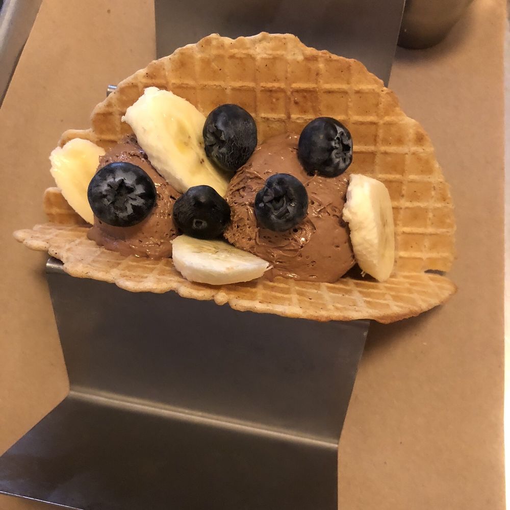 Chocolate dessert waffle "taco" with hazelnut mousse