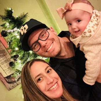 River's Edge Restaurant - Family picture by the Christmas tree - Steakhouses Near Me - Grants Pass, Oregon