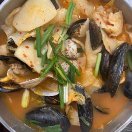 Kimchi seafood soup with flat noodles