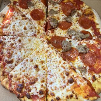 Burattino Brick Oven Pizza - Half pepperoni and sausage, Half Cheese.. Two pieces trying to escape. - Pizza Near Me - Whittier, California Burattino Brick Oven Pizza - Half pepperoni and sausage, Half Cheese.. Two pieces trying to escape. - Pizza Near Me - Whittier, California