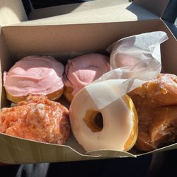 Global Donuts & Deli - Assorted doughnuts Homer doughnut, cherry blossom, apple fritter, Persian doughnut.