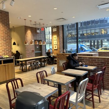 Pret A Manger - a restaurant with tables and chairs - Sandwiches Near Me - New York, New York Pret A Manger - a restaurant with tables and chairs - Sandwiches Near Me - New York, New York