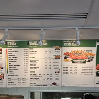Wingstop - The menu board - A menu board features BBQ options, sides, drinks, and desserts, with a promotional section for Sweet BBQ Blaze, in a restaurant setting. - Chicken Wings Near Me - Fairfax, Virginia