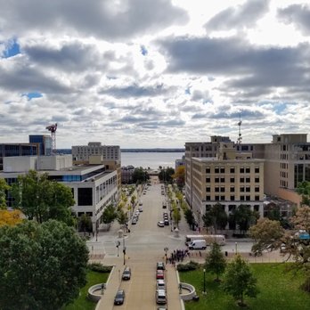 Wisconsin State Capitol - The view toward Monona Terrace from the Capitol observation deck. - Landmarks & Historical Buildings Near Me - Madison, Wisconsin Wisconsin State Capitol - The view toward Monona Terrace from the Capitol observation deck. - Landmarks & Historical Buildings Near Me - Madison, Wisconsin