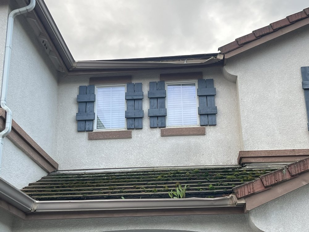 Slide of ML Gutters & Roofing