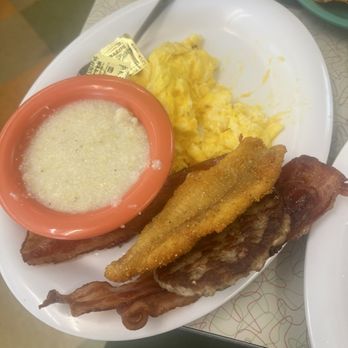 The Silver Skillet - Bacon breakfast with grits, eggs scrambled w cheese. Spicy Catfish Strips from my partners plate. - Breakfast & Brunch Near Me - Atlanta, Georgia The Silver Skillet - Bacon breakfast with grits, eggs scrambled w cheese. Spicy Catfish Strips from my partners plate. - Breakfast & Brunch Near Me - Atlanta, Georgia