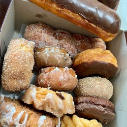 Dozen donuts $16 (cruller, blueberry, strawberry, chocolate bars, etc.). Super fluffy and thick! Dozen donuts $16 (cruller, blueberry, strawberry, chocolate bars, etc.). Super fluffy and thick!