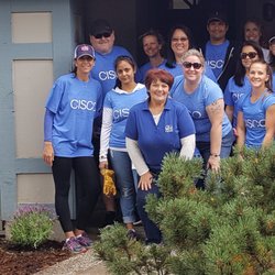 Unity Care Group - Unity Care staff and Cisco volunteers in 2017. Community service project planting and maintaining gardens at Unity Care residential home.