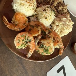 The combo plate with pulled Hawaiian Pork, BBQ sauce with secret ingredients & shrimp. Macaroni & rice, island style. The combo plate with pulled Hawaiian Pork, BBQ sauce with secret ingredients & shrimp. Macaroni & rice, island style.