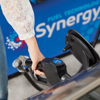 Exxon - a person pumping gas into a car - Gas Stations Near Me - Westlake, Florida
