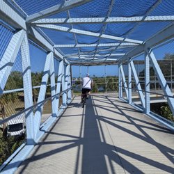 Paradise Life E-Bikes - Take the scenic route! Cross beautiful bridges and discover new paths effortlessly on our e-bikes. Book your adventure today.