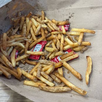 Five Guys - The extra fries in the bag after we took out the 2 containers of fries - Burgers Near Me - Las Vegas, Nevada