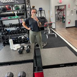 Snap Fitness - Studio room with free weights, punching bag, etc. 1 bathroom on this side and 2 on the other with a shower.