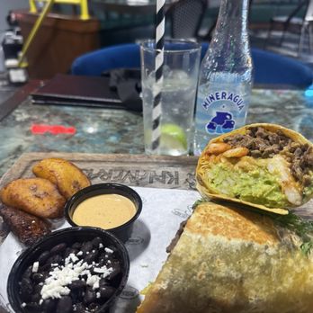 Kalaveras - Kali Burrito asada shrimp shoestring fries queso blanco with side of plantains black beans and chipotle crema - Mexican Near Me - Burbank, California Kalaveras - Kali Burrito asada shrimp shoestring fries queso blanco with side of plantains black beans and chipotle crema - Mexican Near Me - Burbank, California