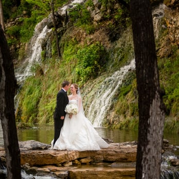Hidden Falls - Bride and groom by waterfalls - Venues & Event Spaces Near Me - Spring Branch, Texas