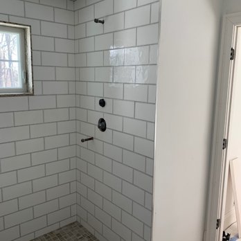 Perfect Way Tile & Stone - a shower in a bathroom - Tiling Near Me