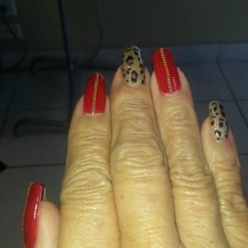 Friendly Nails - He did a Leopard print with red nails and he put a gold chain in each of the red nails. So different! - Nail Salons Near Me - Kailua, Hawaii Friendly Nails - He did a Leopard print with red nails and he put a gold chain in each of the red nails. So different! - Nail Salons Near Me - Kailua, Hawaii