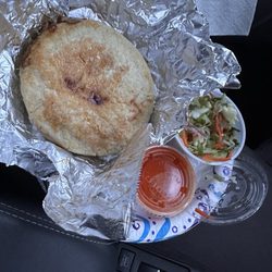 Pork, cheese and bean papusa, slaw and salsa. Delicious!