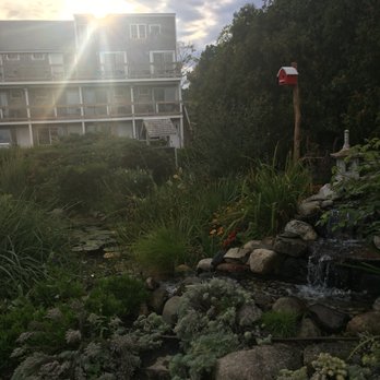 Aspinquid Resort - Sunset over Summer Building & butterfly garden & pond. - Resorts Near Me - Ogunquit, Maine