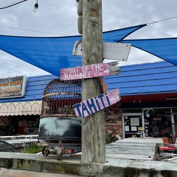 Angie's Subs - a pole with signs on it - Sandwiches Near Me - Jacksonville Beach, Florida