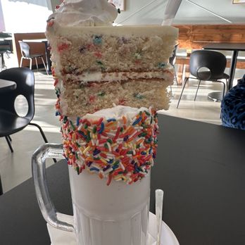 Coco and Hazel - Cake batter shake with funfetti cake slice on-top - Desserts Near Me - Richmond, Virginia Coco and Hazel - Cake batter shake with funfetti cake slice on-top - Desserts Near Me - Richmond, Virginia