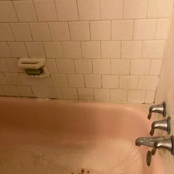 Saving by Reglazing - BEFORE: rusted & discolored tub & tile Embarrassing & worn down tub & tile - Refinishing Services Near Me