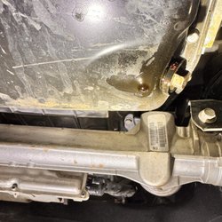 Jiffy Lube - Another picture of the bolt that cannot be tightened. Causing the leak.