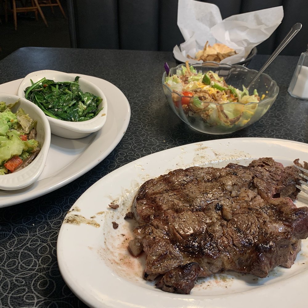 a plate of steak and salad a plate of steak and salad