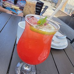 Strawberry lemon fizz with Burmese milk tea in the back
