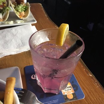 Queen St Warehouse - Pink lemonade with fish tacos in the background - Bars Near Me - Toronto, Ontario Queen St Warehouse - Pink lemonade with fish tacos in the background - Bars Near Me - Toronto, Ontario