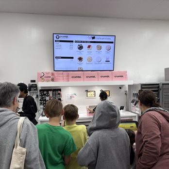 Crumbl - Sunset Valley - Everyone in awe at the cookie choices - Bakeries Near Me - Austin, Texas