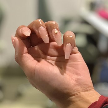 Nail Essence Salon & Spa - Nude pink colorway with pink acrylic powder to set the gold/pearl jewel.  Coffin shape. - Nail Salons Near Me - Morton Grove, Illinois