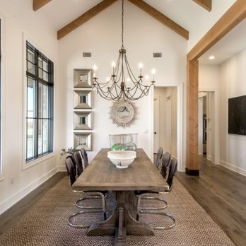 Timeless Interiors - a dining room with a wooden table and chairs - Flooring Near Me - Lakeway, Texas