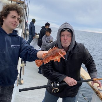 Oceanside Sea Center - Nick the deckhand holding a fish for a quick pic - Fishing Near Me - Oceanside, California