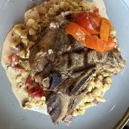 Pork Chop. Dry dry dry.  The Summer Maque Choux underneath the pork chop was REALLY GOOD as were the pickled tomatoes.