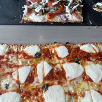 Bare Naked Kitchen - Lavish flat bread Mozz & Moroccan Chicken - Pizza Near Me - Tampa, Florida