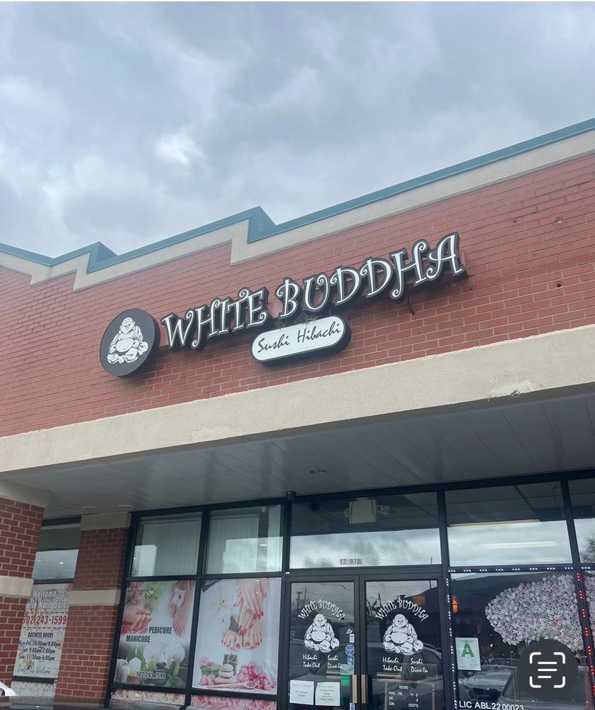 Exterior storefront of White Buddha sushi and hibachi restaurant in Louisville, Kentucky.