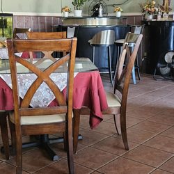 Eastern Classic Thai Restaurant - Interior. Tables have tablecloths with glass on top.